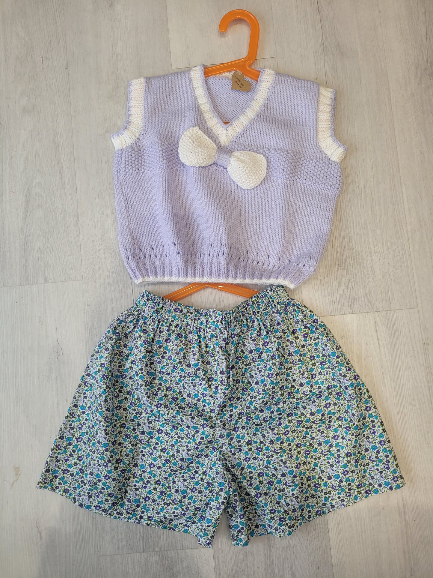 Handknitted lilac girls pull over with bow age 4-5
