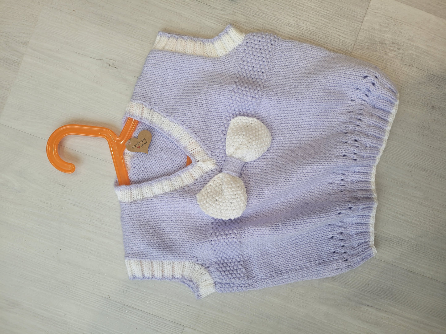 Handknitted lilac girls pull over with bow age 4-5